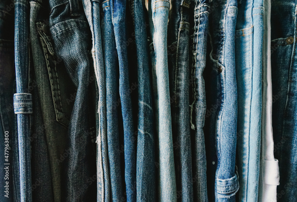 rack of second hand jeans in secound hand shop