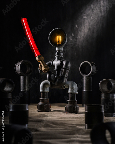 Robot plumber from a set of cast iron metal fittings. Components water supply system, pipeline system. Concept