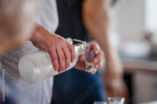 person holding a bottle of vodka