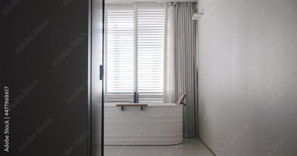 Transparent sliding door opens inside the modern bathroom, minimalist bathtub Transparent sliding door opens inside the modern bathroom, minimalist bathtub