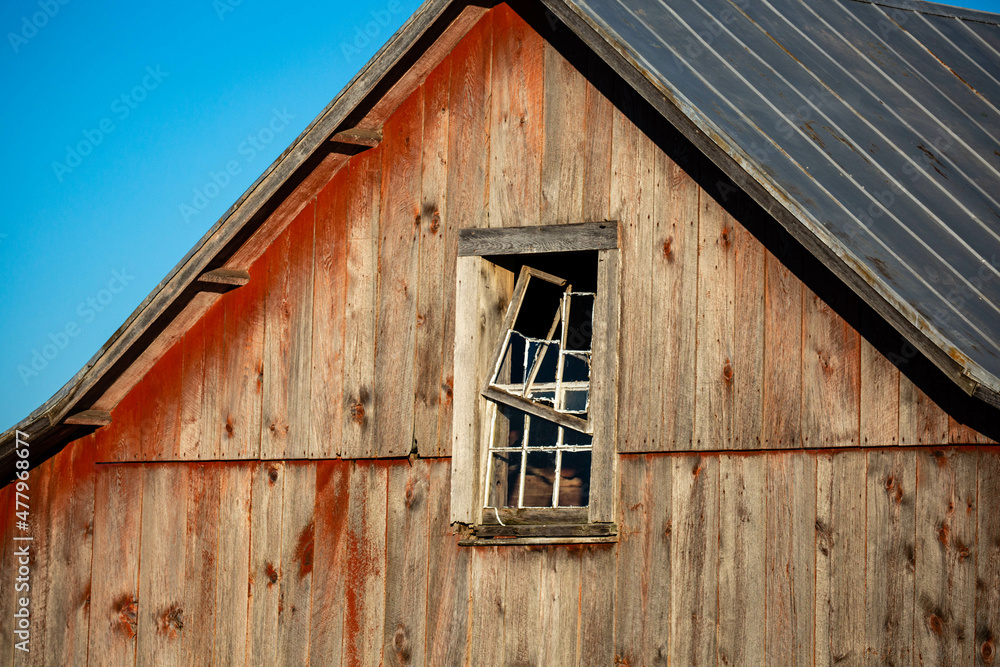 Rustic aged barn siding and broken window Rustic aged barn siding and broken window