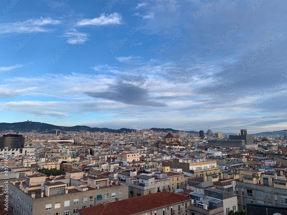 View of Barcelona city skyline from a rooftop. Sagrada de Familia and other famous sightseeing objects in the background. Aerial, panoramic, scenic view of Barcelona. Catalonia, Spain