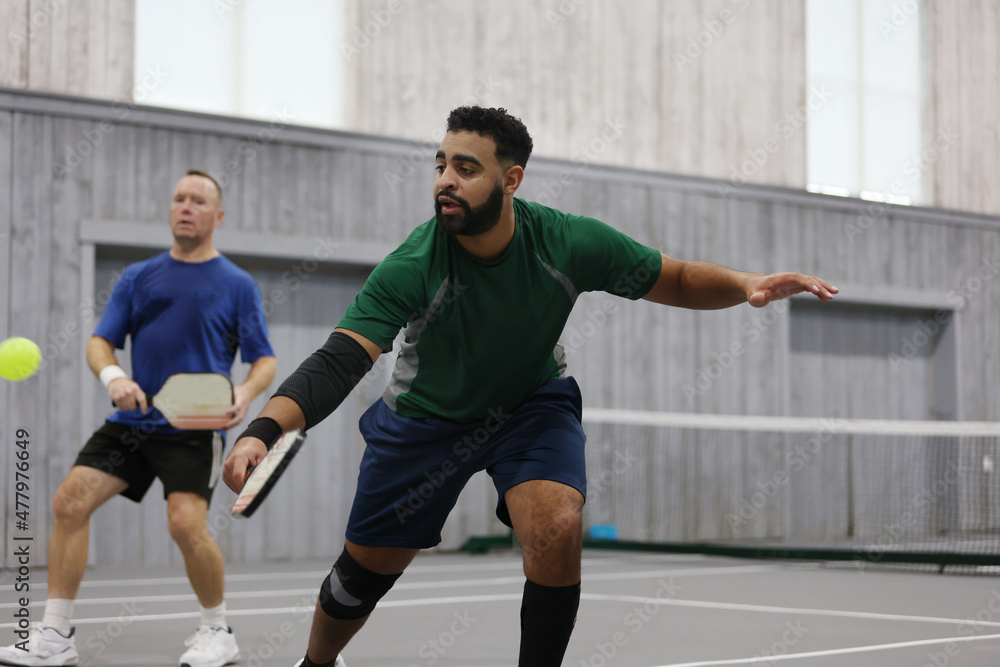 A pickleball dink during a doubles game