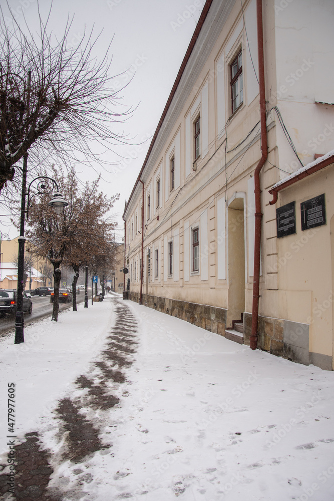 salt on the sidewalk to melt the snow  in December 2021, Bistrita, Romania 