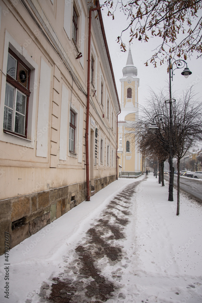 salt on the sidewalk to melt the snow  in December 2021, Bistrita, Romania 