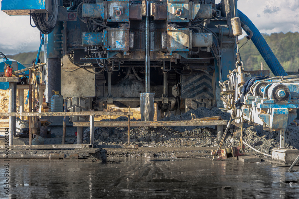 Drilling rig close-up at a construction site. Deep hole drilling. Extraction of minerals oil and gas. Working process. Drilling rig close-up at a construction site. Deep hole drilling. Extraction of minerals oil and gas. Working process.