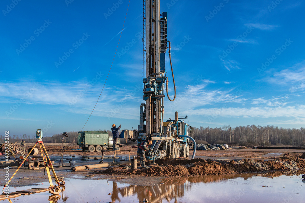 Drilling rig close-up at a construction site. Deep hole drilling. Extraction of minerals oil and gas. Working process.