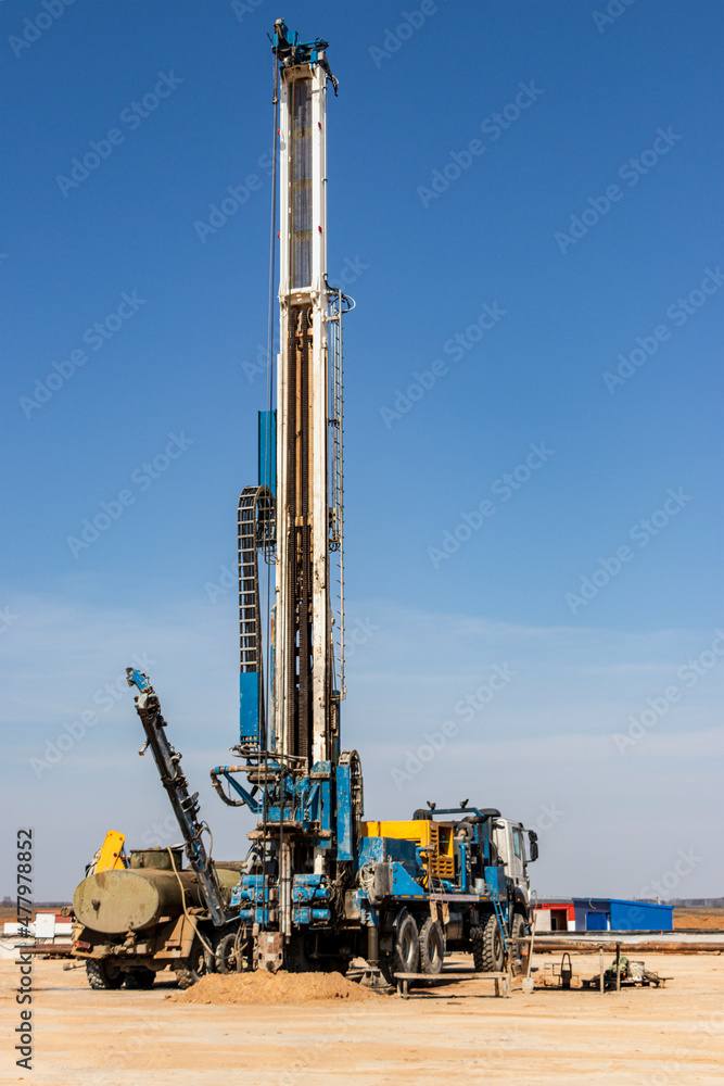 Drilling rig close-up at a construction site. Deep hole drilling. Extraction of minerals oil and gas. Working process. Drilling rig close-up at a construction site. Deep hole drilling. Extraction of minerals oil and gas. Working process.