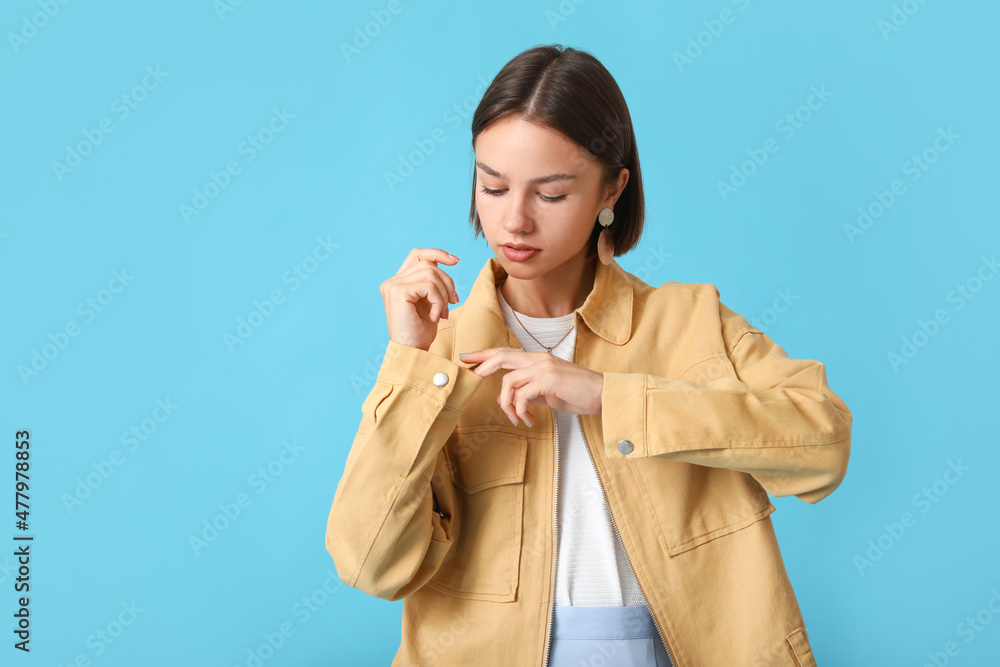 Pretty young woman in stylish clothes on color background Pretty young woman in stylish clothes on color background