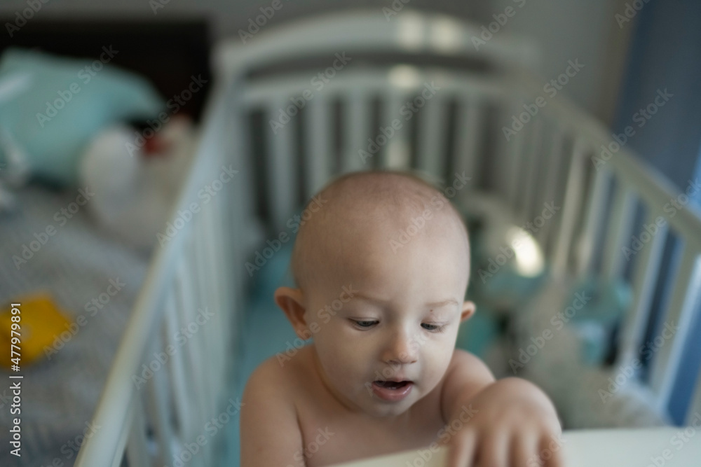 Close up portrait of a nursing baby to himself at home in the bedroom Close up portrait of a nursing baby to himself at home in the bedroom