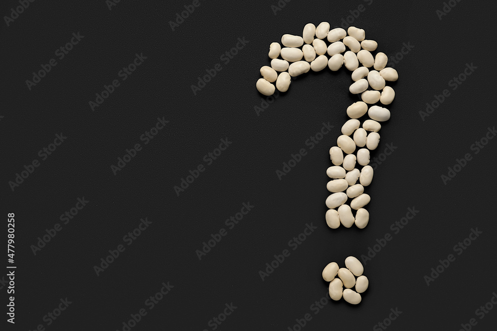 Question mark made of white beans on black background Question mark made of white beans on black background