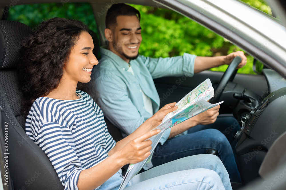 Young loving arab man and woman having car trip together Young loving arab man and woman having car trip together