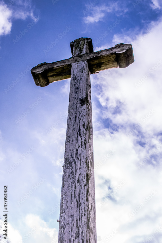 Wooden cross on the sky