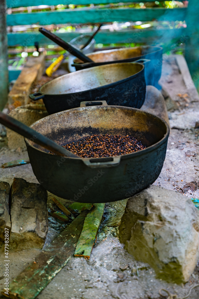 cooking roasting coffee beans over a fire cooking roasting coffee beans over a fire