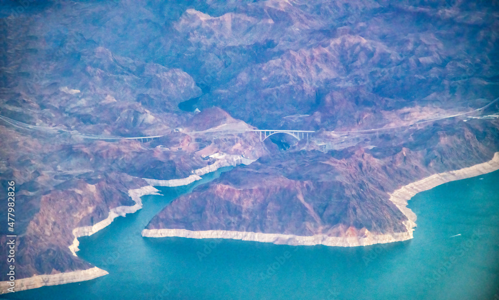 Hoover Dam, aerial view from airplane. It's on the border between the U.S. states of Nevada and Arizona.