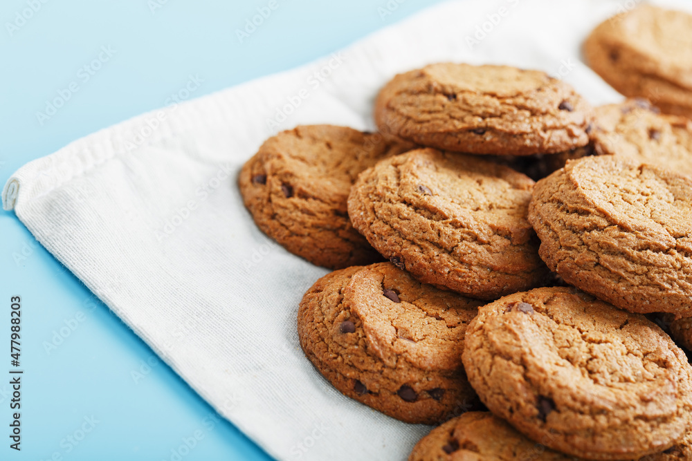 Oatmeal cookies on a napkin on a blue background Oatmeal cookies on a napkin on a blue background