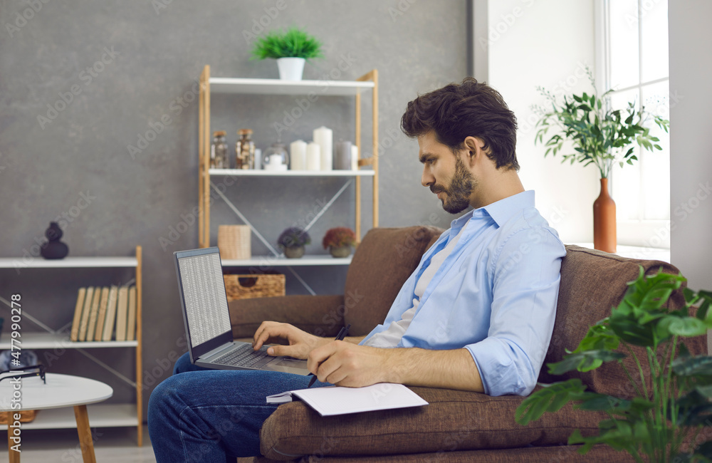 Millennial Hispanic man sit on sofa study online on laptop take course or training. Successful young Latin businessman work on computer, consult client customer. Technology, communication concept.