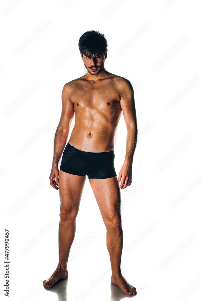 Portrait of an Caucasian male fashion model posing in black underwear Portrait of an Caucasian male fashion model posing in black underwear