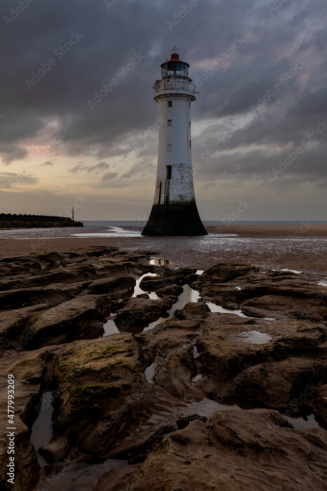 Naklejka premium Perch Rock lighthouse at sunset
