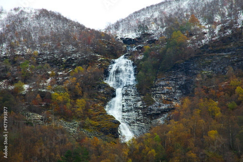 Snowy waterfall in fall