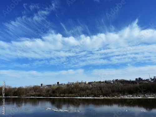 clouds over the spring  river