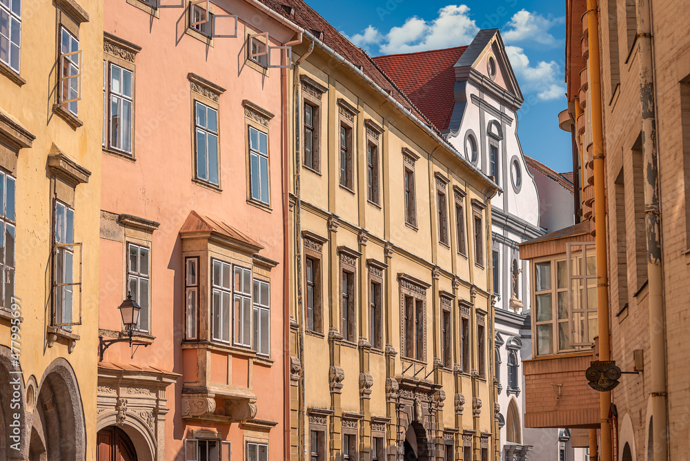Medieval street scene and building facades in the downtown of Sopron, Hungary.