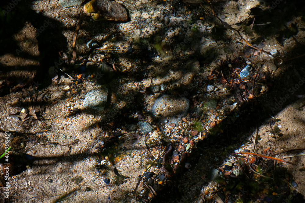 Crystal clear water with small stones at the bottom. Crystal clear water with small stones at the bottom.