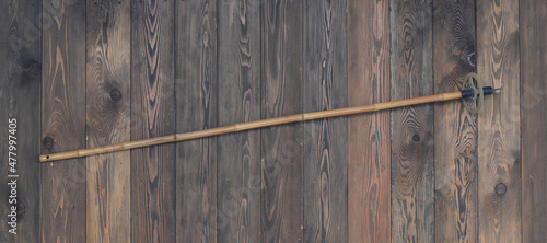 vintage bamboo ski pole on wooden background