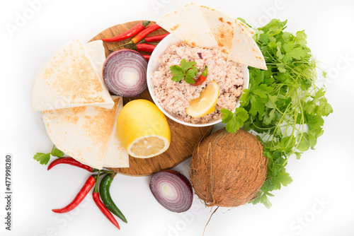 Mas huni, traditional Maldivian breakfast with ingredients on a white background photo