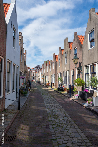 Walking in old Dutch town Zierikzee with old small houses and streets