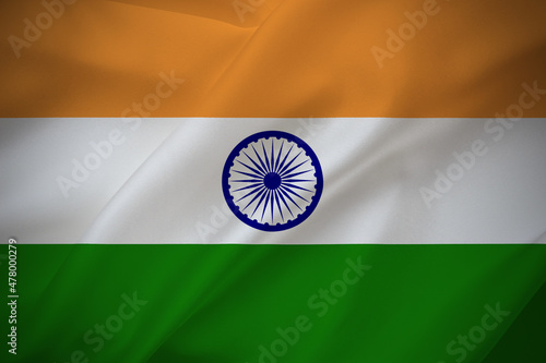 India national flag on waving silk background. Fabric texture.