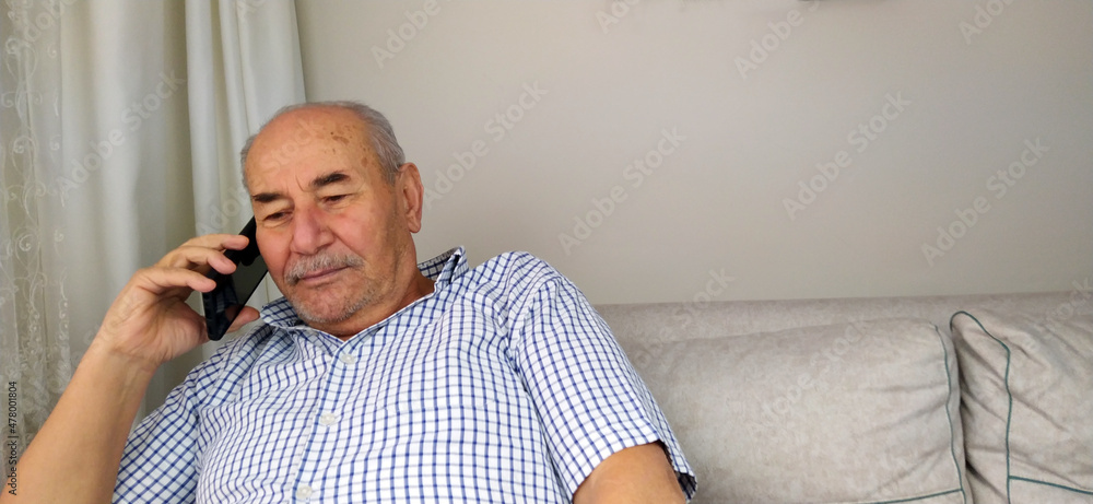 Old man talking on cell phone, grandfather chatting with relatives or grandchildren, mature man making or answering phone call, nice chat Old man talking on cell phone, grandfather chatting with relatives or grandchildren, mature man making or answering phone call, nice chat
