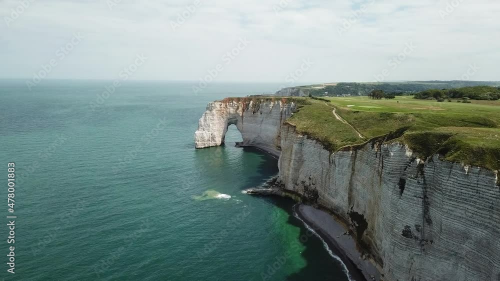 Etretat, France. View from drone of the beautiful chalk cliffs of Etretat, France. Coastline of Normandy in the evening Etretat, France. View from drone of the beautiful chalk cliffs of Etretat, France. Coastline of Normandy in the evening