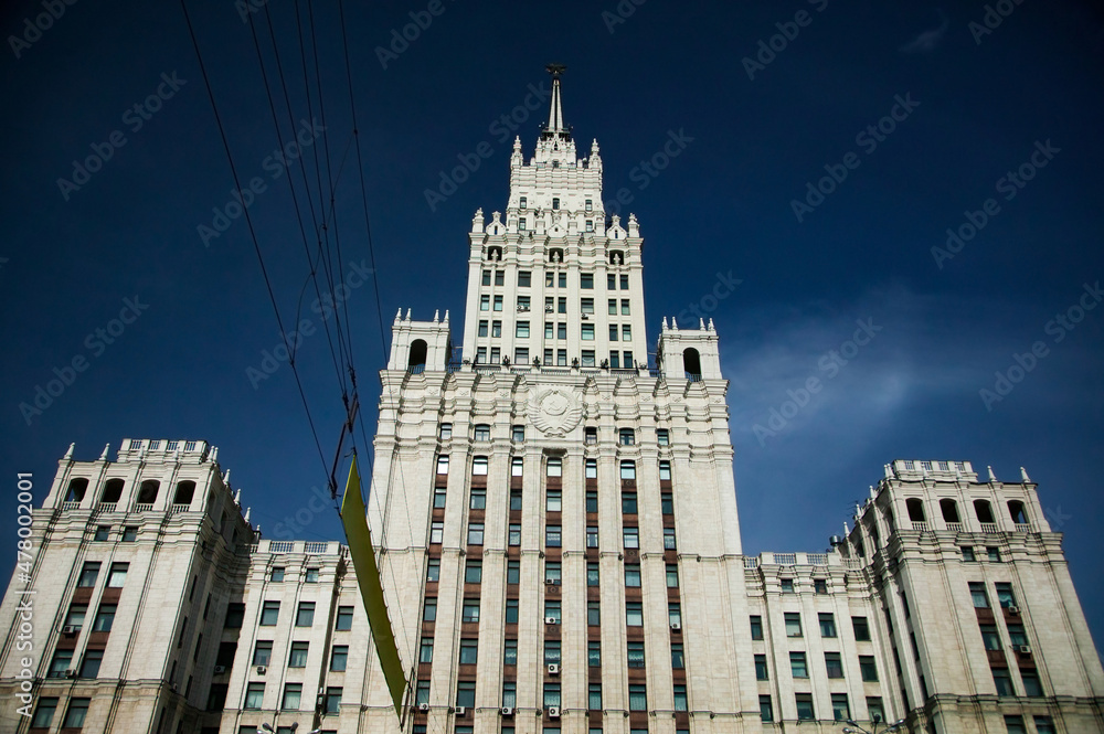 The High-rise building of Ministry of Foreign Affairs of Russia in Moscow. On direct sunlight. On dark blue sky background. One of Stalinist skyscrapers.