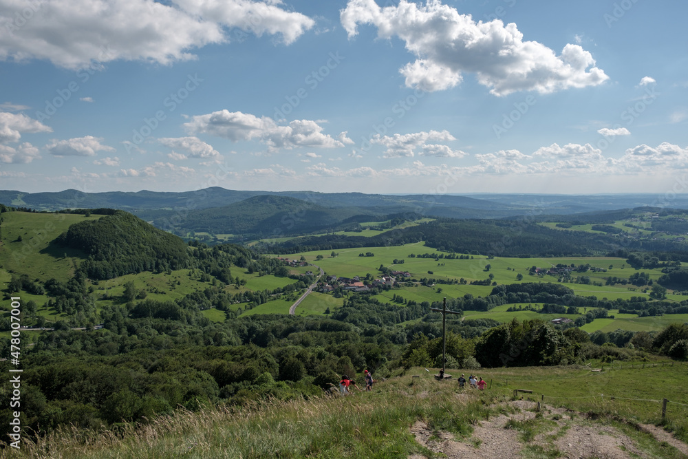 View from the summit of the hill Pferdskopf in the Rhön to the summit cross. View from the summit of the hill Pferdskopf in the Rhön to the summit cross.