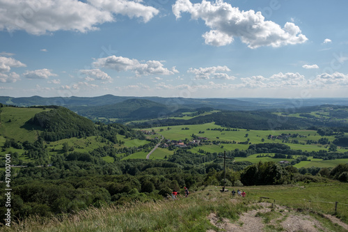 View from the summit of the hill Pferdskopf in the Rhön to the summit cross.