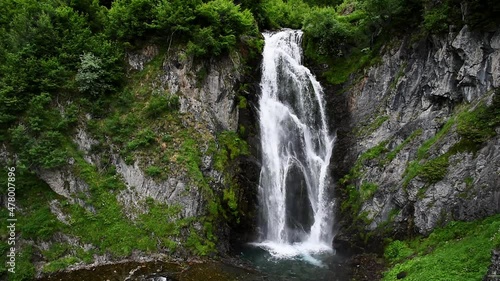 Picturesque waterfall in the mountains (Vall d'Aran, Sauth deth Pish, Spain) photo