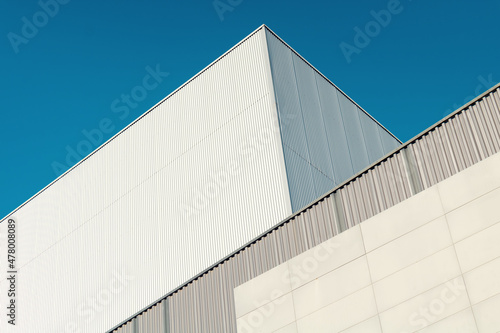 Abstract Modern architecture. Close up of a warehouse in a industrial park.