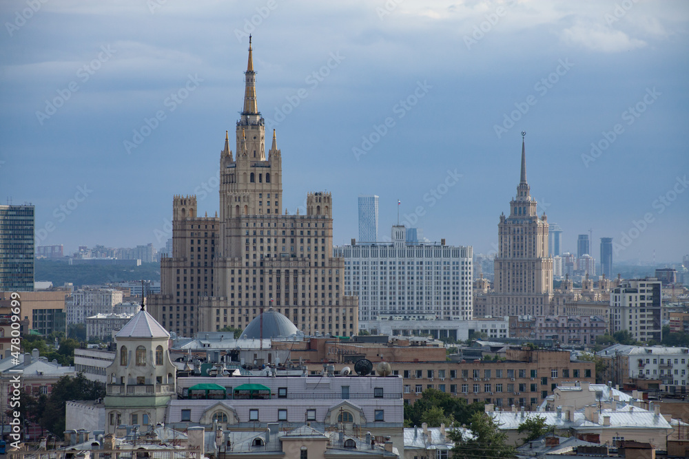 Two Soviet Stalinist skyscrapers and White House of Russia. Moscow. Panorama view of city on the blue sky with light haze or smog. Two Stalinist skyscrapers and White House of Russia. Moscow.