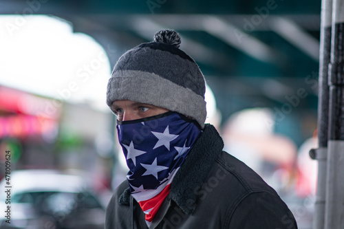 Portrait of a man in a mask us flag pattern, white man model 