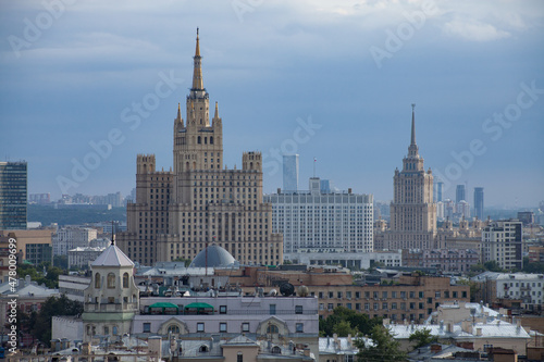 Two Soviet Stalinist skyscrapers and White House of Russia. Moscow. Panorama view of city on the blue sky with light haze or smog. Two Stalinist skyscrapers and White House of Russia. Moscow.