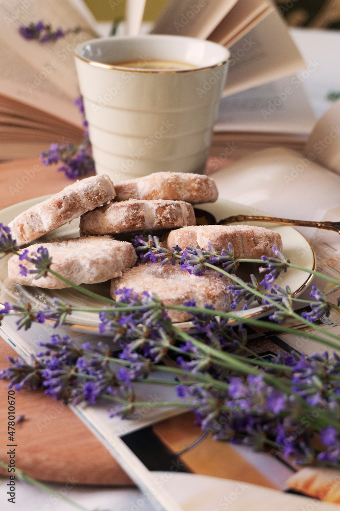 Fototapeta premium Spring. Spring lavender flowers and delicious biscuits. Breakfast Beautiful bright background.