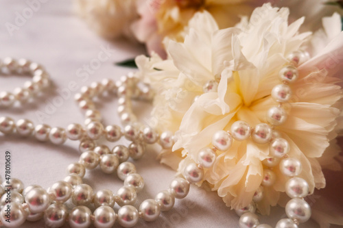 Spring. Spring flowers peonies with pearls. Beautiful bright background.