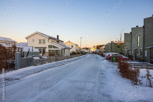 Beautiful view of snowy street of modern village. Europe. Sweden.
