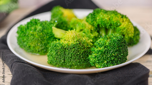 Fresh green broccoli on a light background. Macro photo green fresh vegetable broccoli.