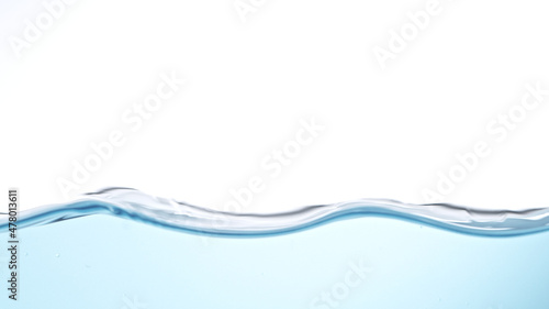Blue water surface background, studio shot, texture of waving water.