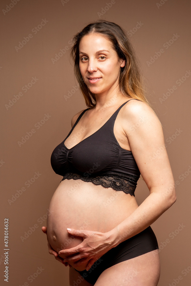 Normal pregnant woman with more than 35 years and 8 months of gestation. Black underwear. Normal pregnant woman with more than 35 years and 8 months of gestation. Black underwear.