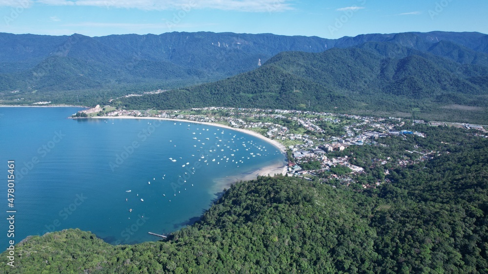 Beautiful deserted beach in Ubatuba, São Paulo, Brazil.
Atlantic forest, yellow sand and clear sea water. Figueira beach paradise. With a view from Tabatinga, Caraguatatuba