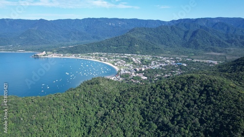 Beautiful deserted beach in Ubatuba, São Paulo, Brazil. Atlantic forest, yellow sand and clear sea water. Figueira beach paradise. With a view from Tabatinga, Caraguatatuba