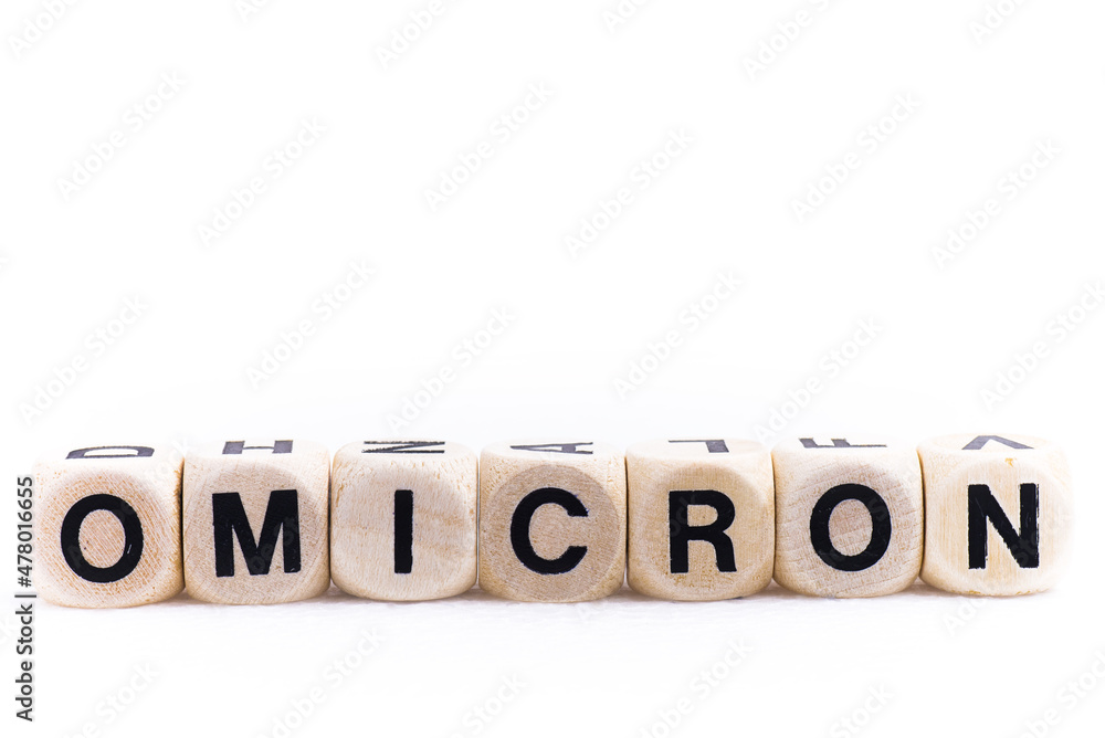 The word OMICRON is formed from bone cubes. On white background. Medical concept, time a new virus (COVID-19) The word OMICRON is formed from bone cubes. On white background. Medical concept, time a new virus (COVID-19)